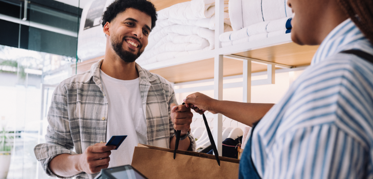 A man smiles while earning discounts on his shopping--thanks to his perks checking account.
